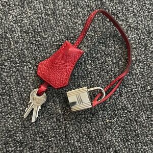 Hermes Palladium Silver Lock and Red Key Holder with Two keys.